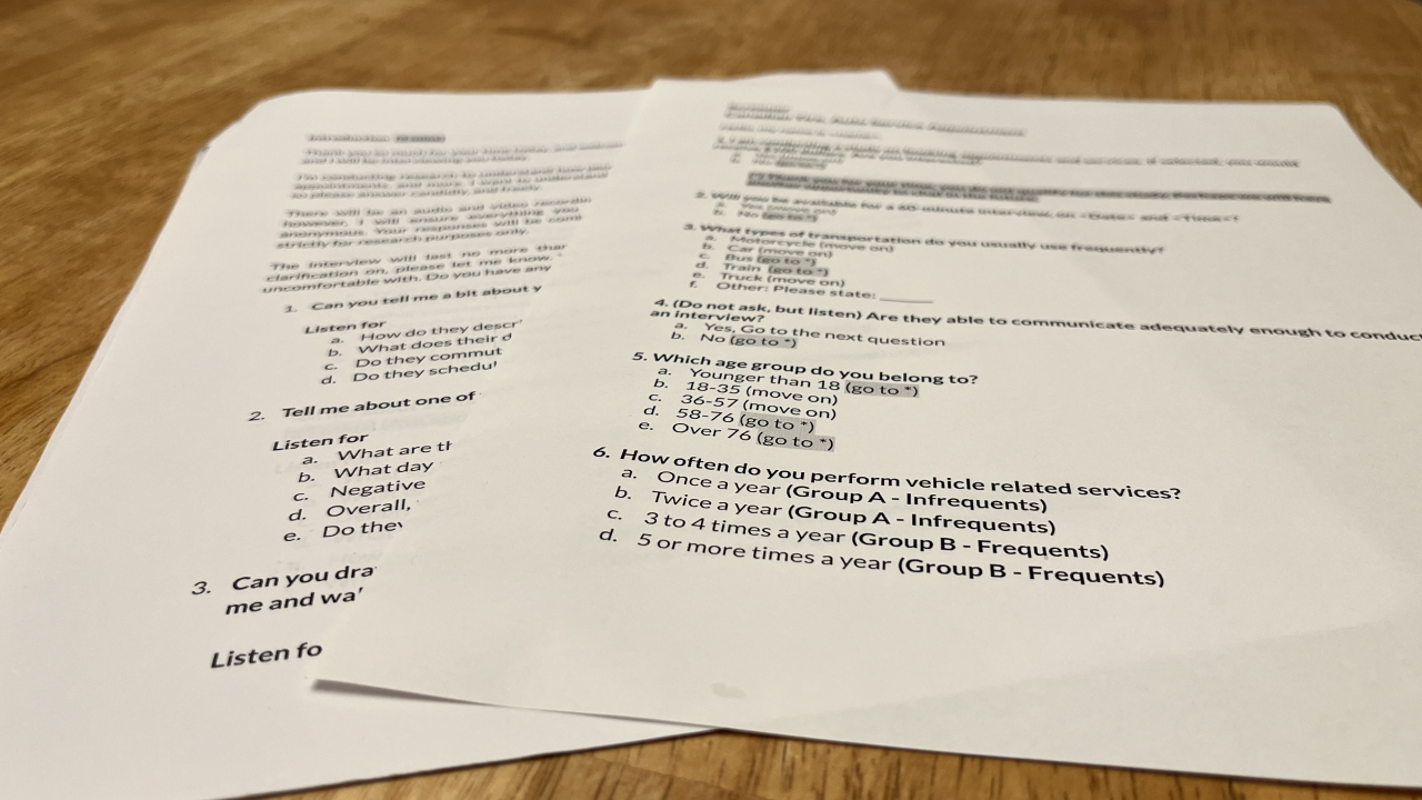 Discussion Guide and Screener laid out on a wood table.